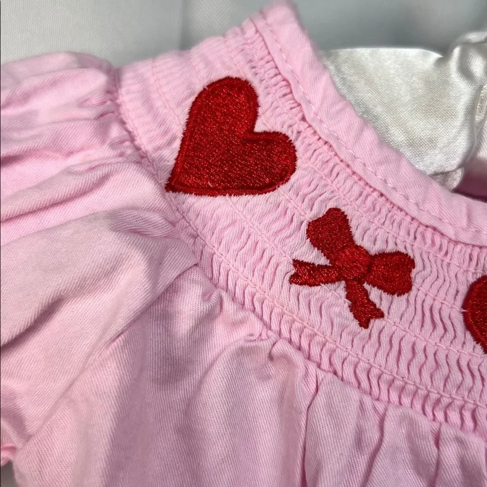 Boutique pink smocked bubble romper with hearts and bows embroidery size 3 month